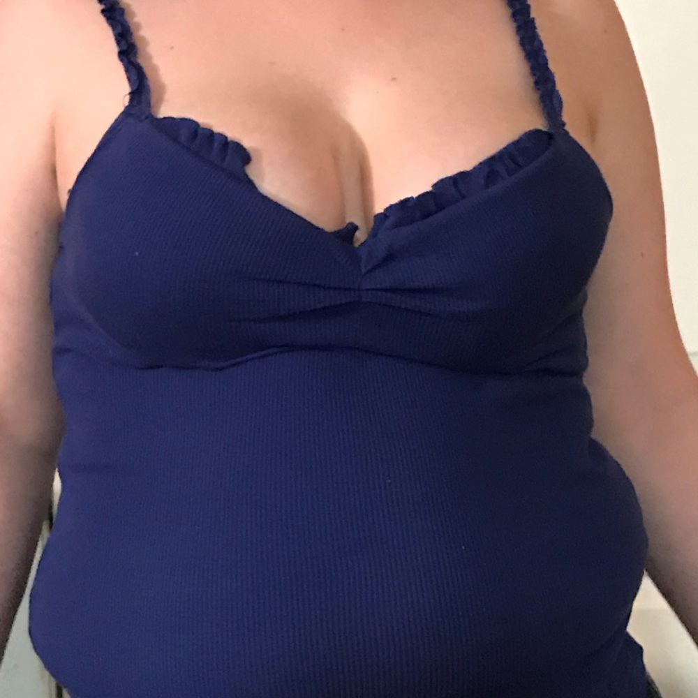 A blue shirt that has spaghetti straps.